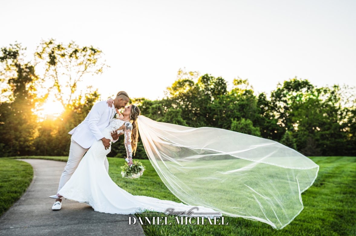 Dip with Flying Veil at Golden Hour with Sun Flare at Drees Pavilion